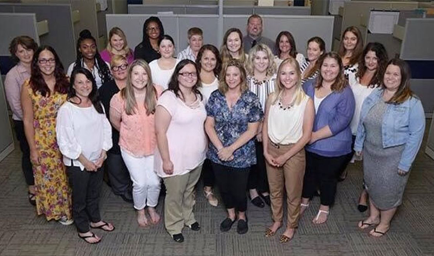 Large group of team members taking a group photo