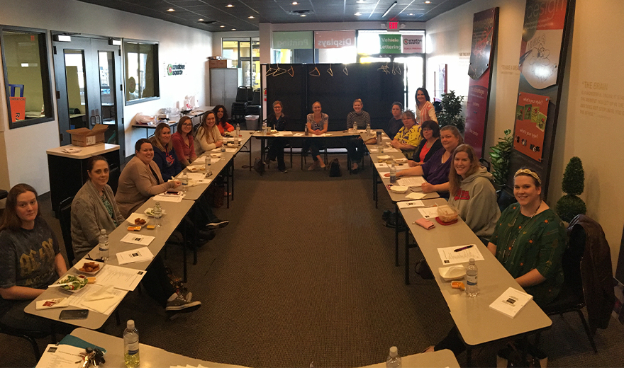 Team members sitting around large table