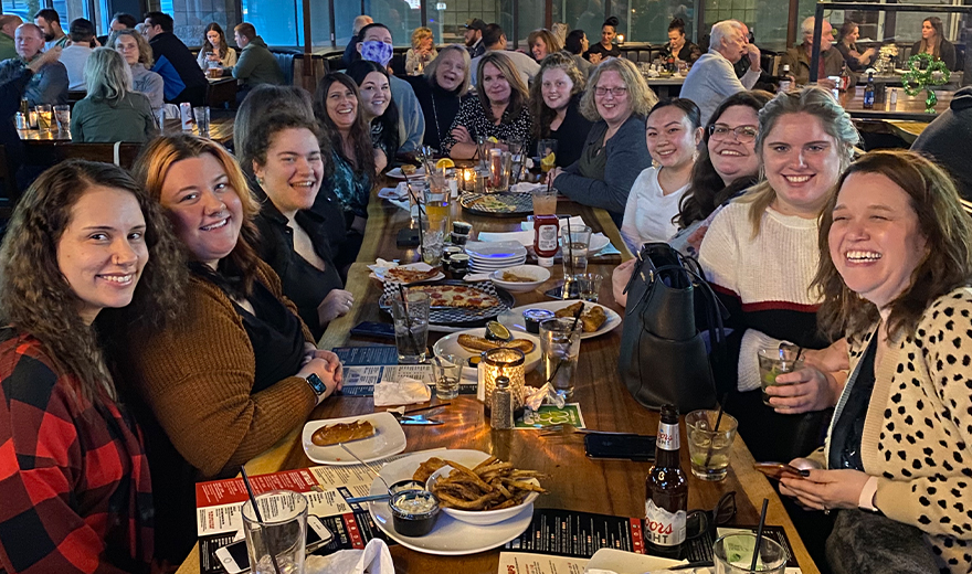 Dental team members eating together at a restaurant