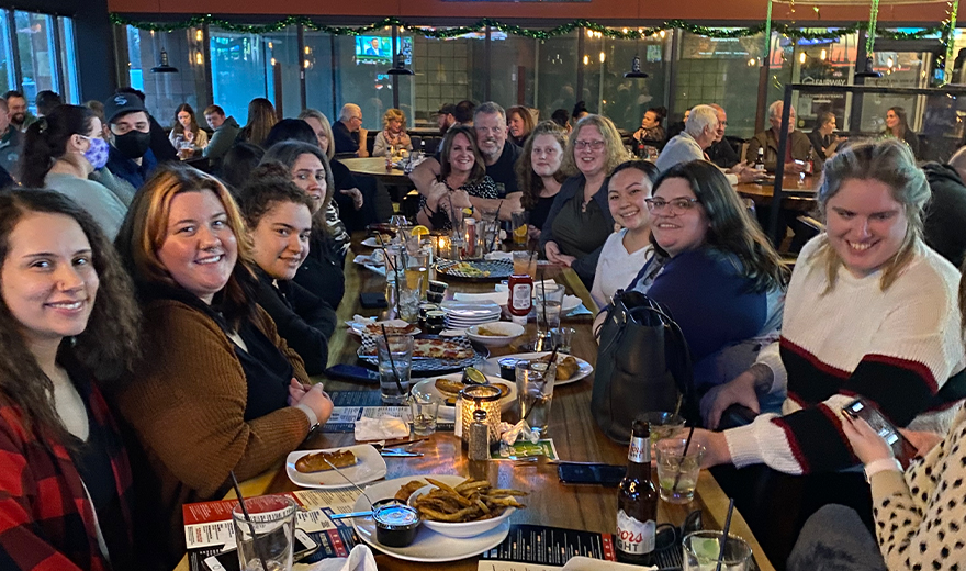 Dental team members eating together at a restaurant