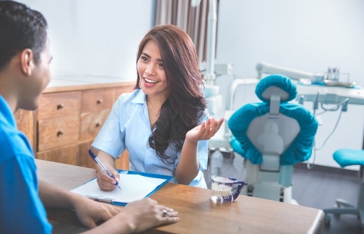 Dental team member discussing protocols