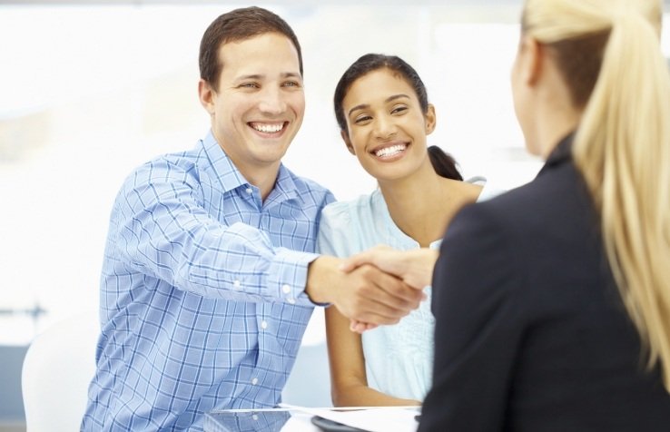 Dental patients smiling in dental office