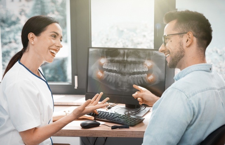 Dentist talking to dental patient