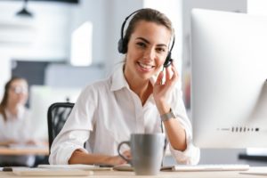 woman smiling wearing headset