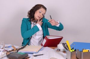 busy receptionist dental practice