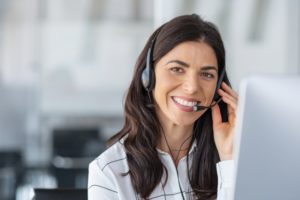 woman smiling at dental answering service