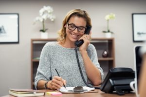 smiling woman talking on the phone