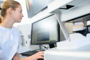 woman working with dental scheduling software