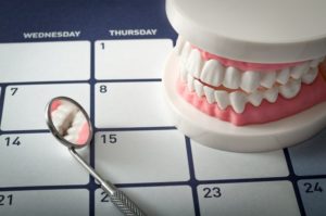 teeth and mirror on a calendar