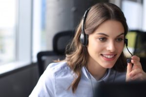 woman hard at work for a dental answering service