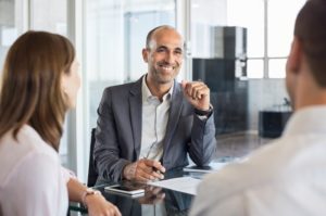 dentist having a consultation with a dental billing company