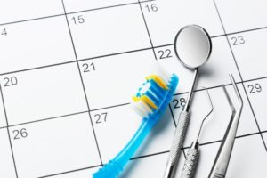 calendar with instruments showing the need to fill your dental schedule