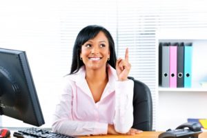 receptionist pointing and having an idea