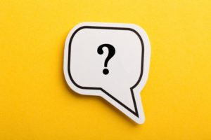 question mark in a speech bubble with a yellow background