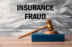 insurance fraud words with a judge’s gavel