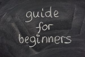 guide for beginners written on a chalk board