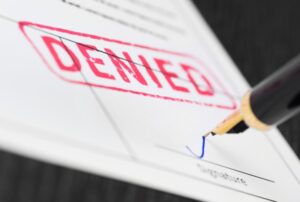 paper with a DENIED stamp on it