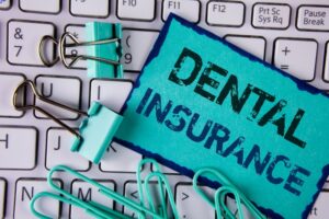 dental insurance sign with keyboard and clips