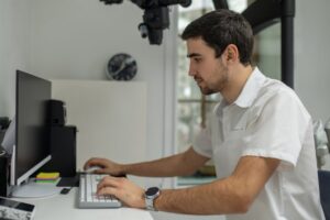 dentist working at a computer